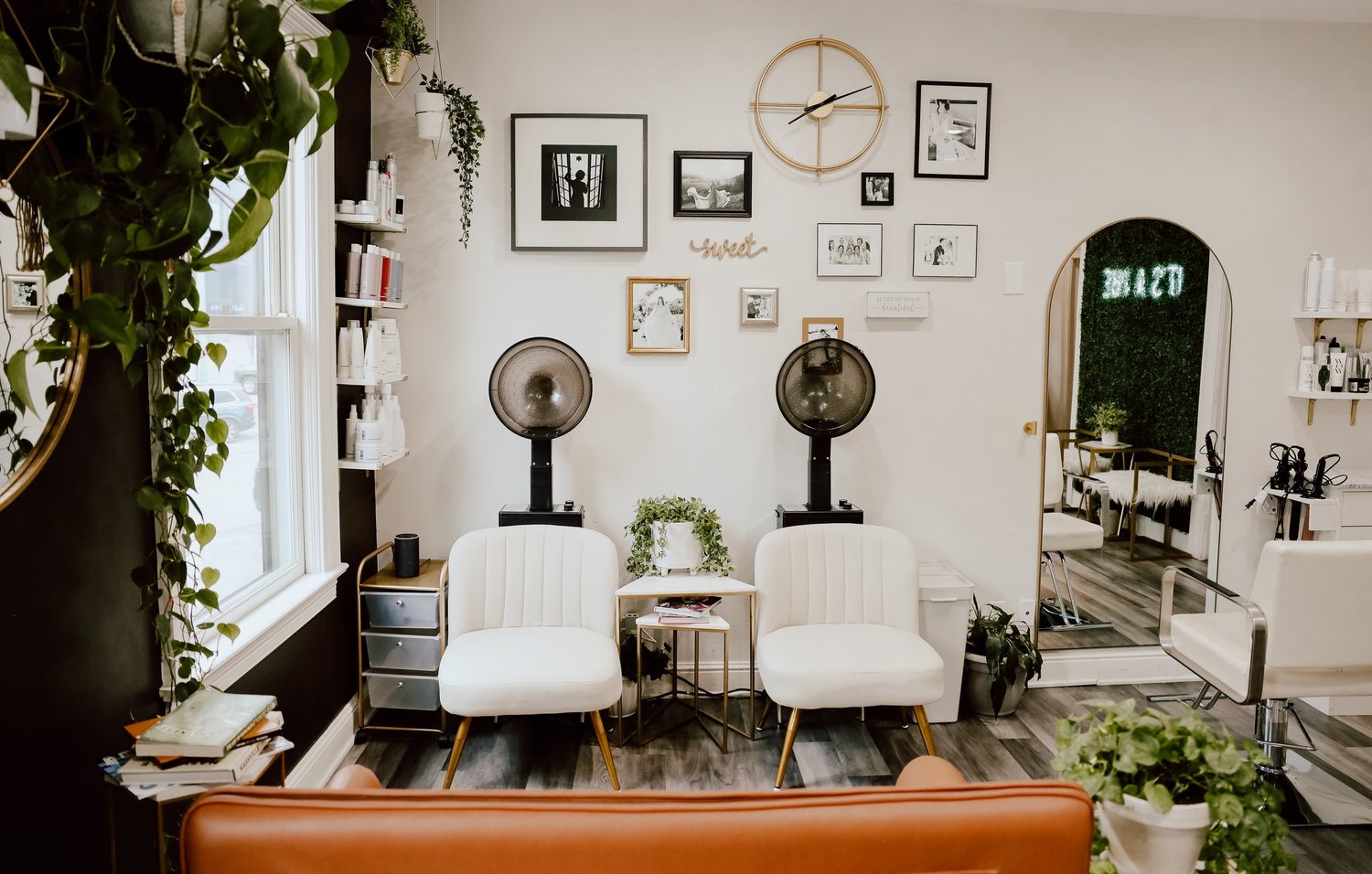 Dryer chairs and the gallery wall inside Sweet Melissa Salon