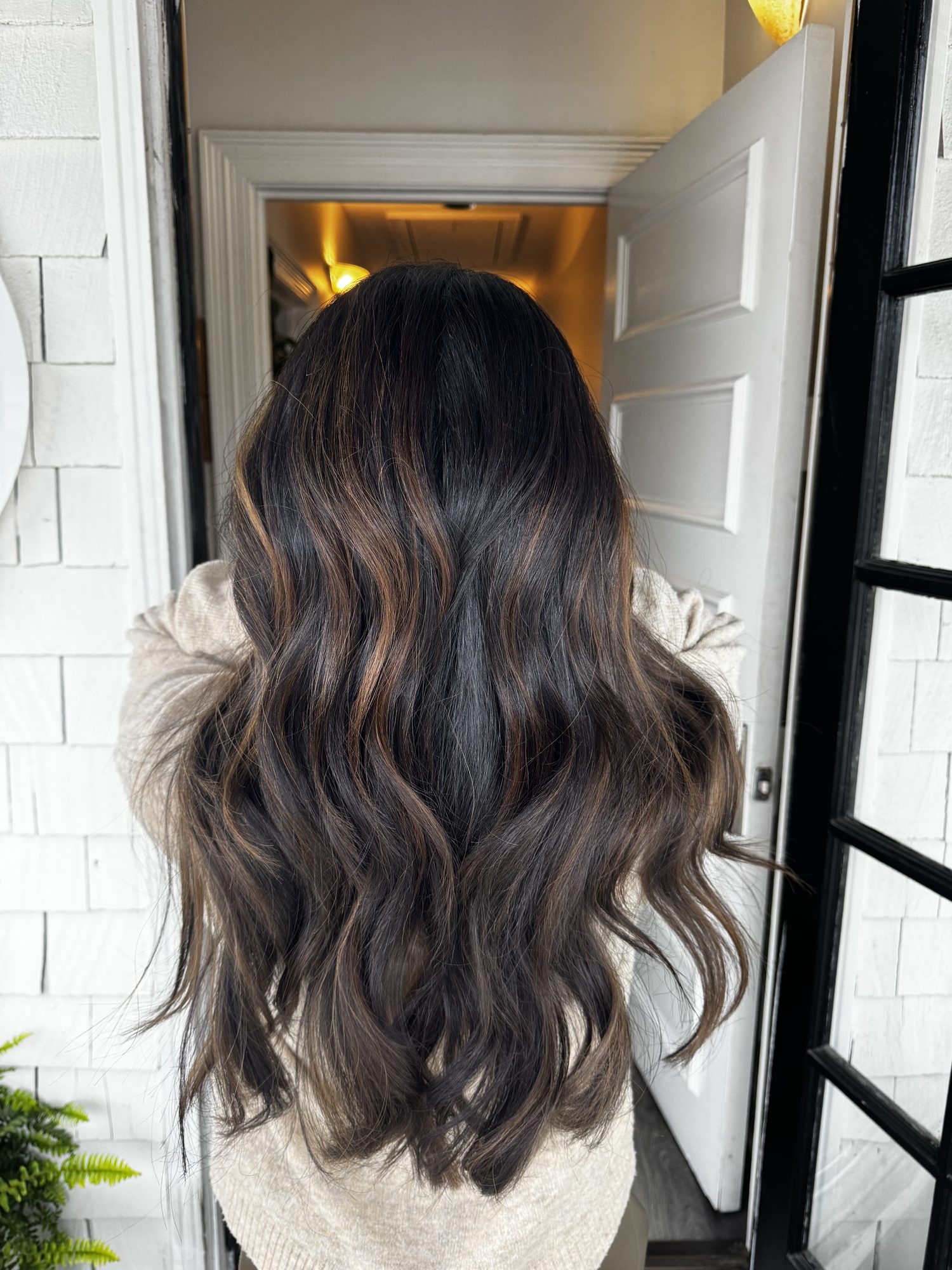 Dark brunette hair with caramel balayage, smooth and shining