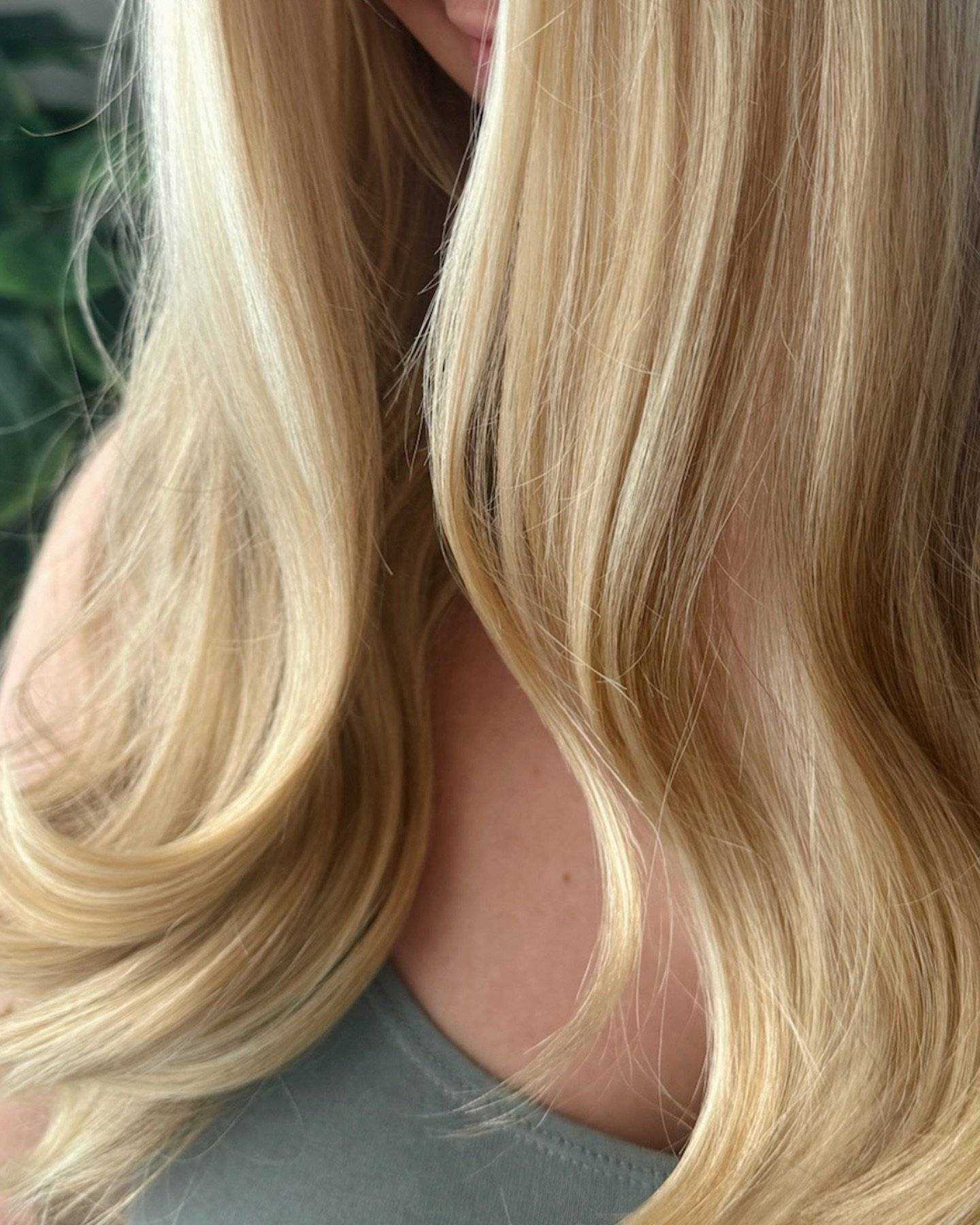 Soft blonde waves with dimensional lowlights