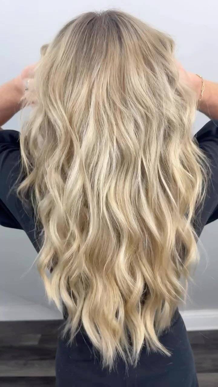 Long blonde layers photographed from behind